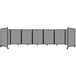 A long shot of a light gray Versare room divider with six panels.