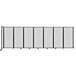 A clear poly wall-mounted room divider with black trim.
