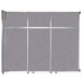 A grey room divider with metal frame and silver trim.