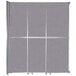 A Cloud Gray Versare operable wall room divider with silver trim.