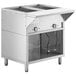 A ServIt stainless steel electric steam table with a partially enclosed base on a school kitchen counter.