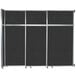 A black rectangular Versare sliding room divider with silver trim.