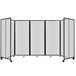 A clear polycarbonate Versare room divider with four panels.