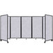 A Versare marble gray SoundSorb folding room divider with four panels.