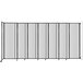 A clear poly Versare wall-mounted room divider.