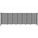 A light gray Versare Poly StraightWall sliding room divider on wheels.