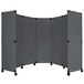 A grey Versare folding partition with wheels.