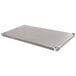 An Advance Tabco stainless steel undershelf for a work table.