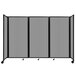 A light gray Versare foldable room divider with polycarbonate panels on wheels.