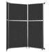 A black Versare room divider with silver trim on the panels.