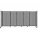 A light gray Versare room divider with black metal frame.