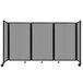 A light gray Versare room divider with three panels on wheels.