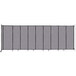 A Versare Cloud Gray StraightWall room divider panel with black straps.