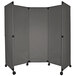 A grey folding screen on wheels.