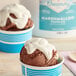 a cup of ice cream with a blue and white container