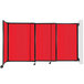 A red and black wall-mounted Versare StraightWall room divider with black wheels.