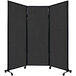 A Versare room divider with black fabric on wheels.