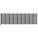 A light gray Versare wall-mounted room divider with black lines on rectangular panels.