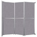 A Versare room divider with grey fabric panels.