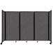 A Versare charcoal gray foldable room divider with wheels.