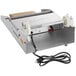 A VacPak-It film wrapping machine with an electric cord and white plastic handle.