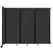 A black Versare wall-mounted room divider with four panels and wheels.