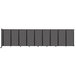 A Versare charcoal gray wall-mounted room divider with four panels.