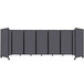 A Versare dark grey SoundSorb room divider with black poles and grey panels.