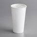 a white cup with a lid