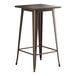 A Lancaster Table & Seating copper bar table with a square top.
