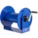 A blue Coxreels hand crank hose reel with a handle.