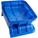 A blue plastic lid for a Lavex cube truck.