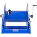 A blue metal Coxreels hand crank hose reel with a handle and a hole in it.