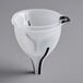 A white funnel with a black handle.