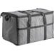 A gray insulated cooler bag with black straps.