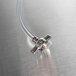 A stainless steel tube with a metal pipe on the end.