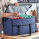 A man holding a Choice large insulated cooler bag full of cans.