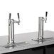 A Beverage-Air kegerator with one single and one double tap for wine on a counter.