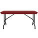 A red rectangular Correll folding table with black pedestal legs.