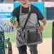 A man holding a Choice insulated cooler bag.