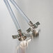 Two stainless steel tubes with a nut attached.