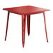 A Lancaster Table & Seating red metal table with legs.