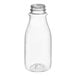 A clear PET juice bottle with a tapered neck on a white background.