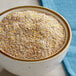 A bowl of Bob's Red Mill 10-Grain Cereal on a table with a blue cloth.