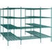 A green metal Regency wire shelving unit with four shelves.