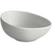 A light gray irregular round melamine ramekin.