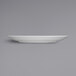 A Fortessa Caldera bright white china plate on a gray background.