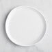 A white GET Enterprises Riverstone melamine plate.