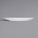 A white plate with a small rim on a gray background.