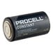 A Procell Constant D 1.5V Alkaline battery with black and white packaging.